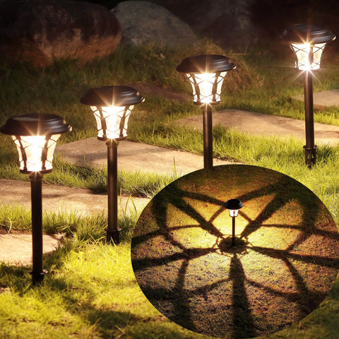 6 Pack Solar Powered Pathway Lights, 25 Lumen SMD LED, casting warm white glow on garden path at night