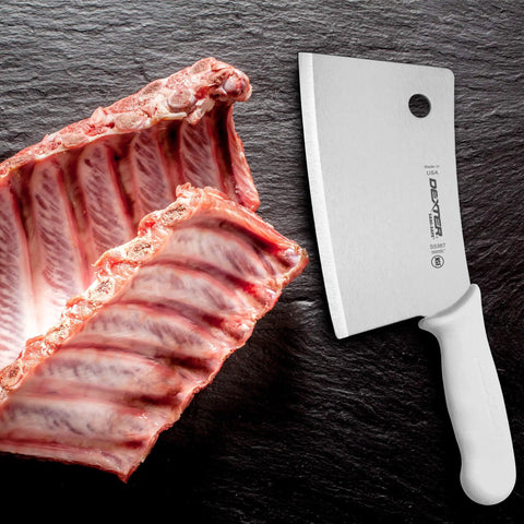 7 Inch Meat Cleaver With High Carbon Steel Blade Textured Slip Resistant Handle NSF Certified Heavy Duty Butchering Knife For BBQ And Kitchen Prep Made In USA next to raw ribs