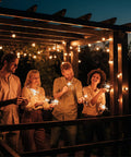 People enjoying backyard ambiance under 48Ft 15-Socket LED Outdoor String Lights With Remote Control Alexa Compatible And Smart Life App