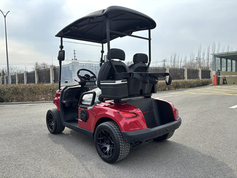 Top Shelf Two Seater Electric Golf Cart Equipped With A Dependable 48V Lithium Battery And Punchy Lightweight Frame For Sweet All Terrain Cruising In Fiery Red, showing rear view with black rims.