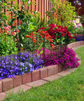 Garden Fence Panels Set Of 10 Arched Rustproof Metal Border Fence For Dogs And Pets No Dig Yard Edging installed in flower bed.