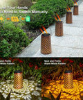 Outdoor Solar Lanterns 4 Pack Hanging Garden Lights Waterproof Metal Yard Pathway Landscape Decor Lamps With 2 Lighting Modes And No Fuss Setup For Backyard Patio And Easy Nighttime Illumination displayed on a pathway and creating light patterns on the ground.
