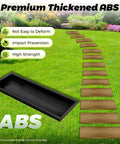 Two Pack Wood Like Paving Molds For Concrete Stone Walkways And Sidewalks With Real Wood Grain Texture Durable ABS Cement Molds shown in garden