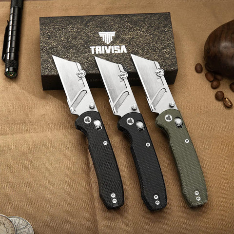 Folding Utility Knife With 2.62 Inch Razor Blade, 5 Extra Replacement Blades, EDC Camping Knife With Pocket Clip, displayed on table