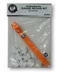 Dr.Speedometer GM gauge repair kit front view: orange plastic pry tool and white circular gauge motor discs in bag