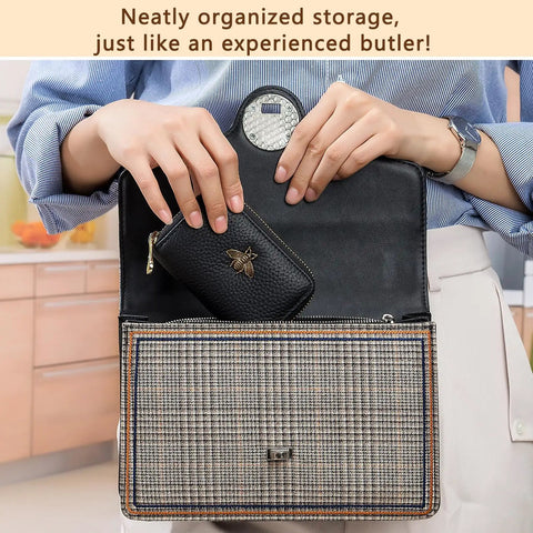 Woman placing RFID Blocking Leather Card Holder For Women Tiny Zipper Wallet With Bee Accent into handbag, compact design shown.