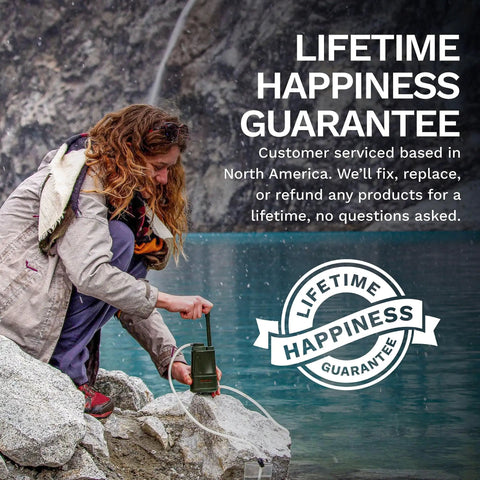 Person using a 0.01 Micron Portable Water Filtration System For Real Survival, Backpacking And Camping by a lake with Lifetime Happiness Guarantee