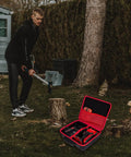 Open Beefy Rugged Hard Storage Case For Craftsman V20 Cordless Drill Kit on grass beside man chopping wood.