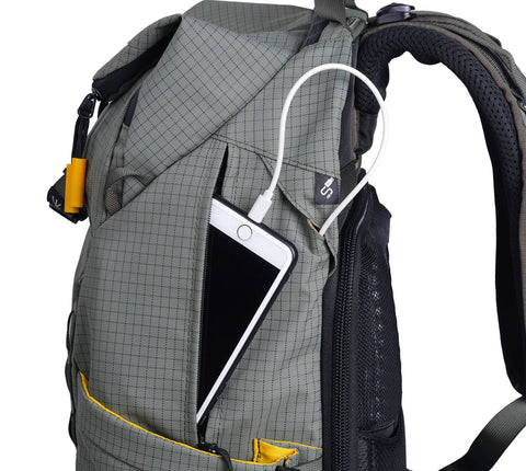 Side view of Active 53 Camera Backpack With Front Rear And Top Access For Gear Built In USB Charger Port For Power Bank in Khaki Green
