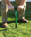 Person using 20 Inch Soil Probe For Lawn Core Sampling And Soil Testing, Durable 12 Inch Depth Sampler on grass