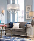 Living room with Crystal Pendant Drum Chandelier in Chrome Finish, Four Light LED Ceiling Fixture, 19 Inch Diameter.