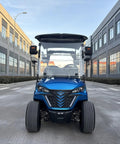 Kick Back In Style On This 2 Seat Electric Golf Cart Designed For Sightseeing And Leisure With Smooth MacPherson Strut Suspension 4KW Motor Advanced Disc Brakes And Huge Touchscreen Entertainment Setup, front view on urban street.