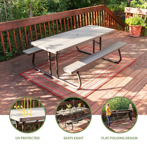 Six Foot Folding Picnic Table With Classic Rugged Steel Frame Seats Eight UV Protected Top Weather And Rust Resistant Flat Fold For Easy Stow And An Umbrella Hole For Backyard Hangouts on a deck.