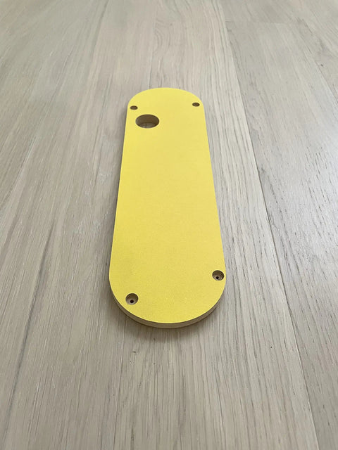 Zero Clearance Inserts Set Five Pack For DWE7485 Table Saw, pro-grade yellow aluminum insert plate shown on wooden surface
