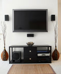Modern living room setup with wall-mounted TV, sleek black media console, two tall vases, and stereo system beneath.