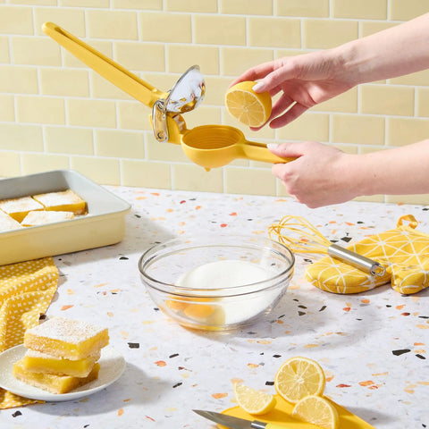No Fuss Lemon Squeezer Citrus Juicer in use over mixing bowl on kitchen counter