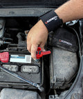 Person using 5 Piece Battery Maintenance Kit With Terminal Cleaner, 10mm Ratchet, Battery Pliers on car battery