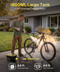 Behome Portable Steam Cleaner With 15 Second Quick Heat Up, 3-Level Adjustable Handle, And 1.9 Qt Large Tank cleaning a bicycle outdoors.
