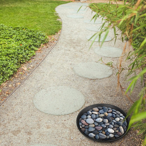 Three Size Round Stepping Stone Molds Set For Concrete Casting 10 Inch 11.4 Inch 12.6 Inch Plastic Molds installed in a garden path