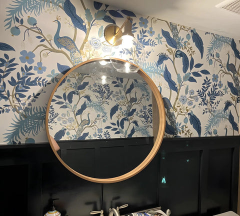 Retro Sconce With Slope Pole Wall Mount And 7.9 Inch Glass Globe Shade In Antique Gold Finish above round mirror on floral wall