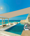 30 X 32 Foot Rectangle Sun Shade Sail With Heavy Duty UV Resistant Fabric Wire Cable And A Rings Weather Resistant Outdoor Canopy Cover For Pergola Backyard Or Garden Sand Color stretched above poolside area