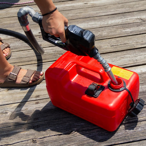 Person refueling with Three Point Two Gallon Portable Boat Fuel Tank With 2 Way Vented Cap Built In Fuel Gauge And Easy Grab And Go Handle