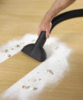 Person using vacuum with High Efficiency Disposable Filter Bags For 15-22 Gallon Tanks White 2-Pack collecting drywall dust