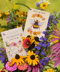 Bentley Pollinator Mix Ready-To-Sow Wildflower Seeds Packets displayed among blooming colorful flowers