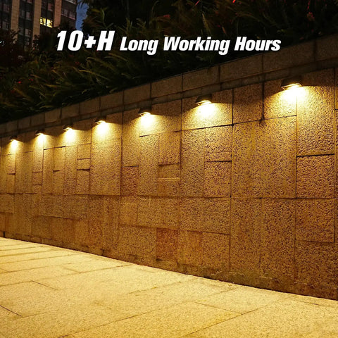 Solar Fence Post Lights 6 Pack, Waterproof Outdoor LED Fence Lighting on stone wall, providing warm glow, no fuss installation
