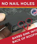 Close-up of nail free roof cable clip with barbs for heat tape, shown on shingle, safe for preventing roof damage, 0.325 inch size.
