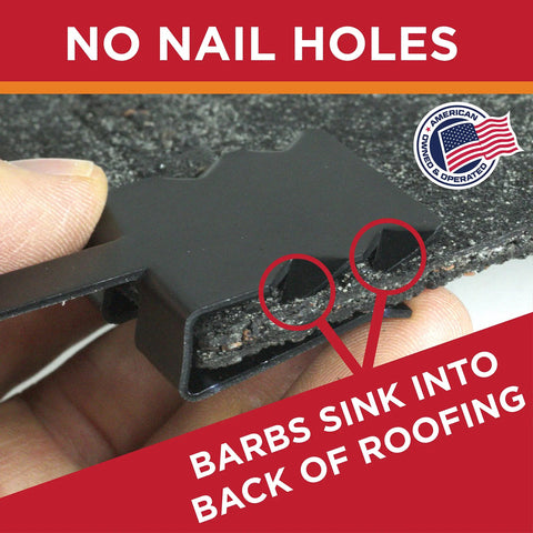 Close-up of nail free roof cable clip with barbs for heat tape, shown on shingle, safe for preventing roof damage, 0.325 inch size.