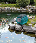 Beast Linear Air Pump 1110 GPH for Ponds, Wastewater, Hydroponics, Aquariums, and Fish Farms by a natural pond.