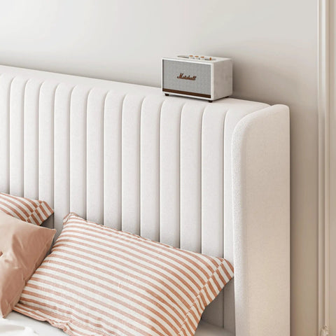 Top Notch Full Size Bed Frame With White Velvet Upholstery And Tufted Wingback Headboard Heavy Duty Steel Rails Solid Slats No Box Spring Needed Clean Bedroom Flex with striped pillows and a speaker.