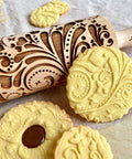 Beech Wood Embossed Rolling Pin With Butterflies And Flowers For Cookies And Crafts Handmade Kitchen Tool For Beautiful Patterns Ideal Gift For Mom Or Best Friend Great For Bakers And Hobbyists with embossed cookies showing floral and butterfly designs.
