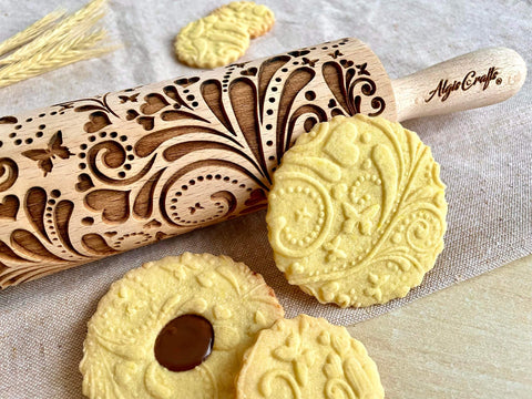 Beech Wood Embossed Rolling Pin With Butterflies And Flowers For Cookies And Crafts Handmade Kitchen Tool For Beautiful Patterns Ideal Gift For Mom Or Best Friend Great For Bakers And Hobbyists with embossed cookies showing floral and butterfly designs.