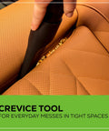 Cordless 40V 3 Gallon Wet Dry Shop Vacuum With Extras in use on car seat with crevice tool attachment, close-up view.