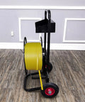 Top Shelf Banding Strapping Cart For Steel And Poly Strap Rolls, side view with yellow strap on sturdy black frame and tool bin.