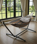Double Hammock With Foldable Steel Stand And Carry Bag For Indoor Outdoor Use 450 Lbs Capacity Garden Camping Beach Coffee Color Easy Setup Portable Backyard Kick Back in a sunlit room.