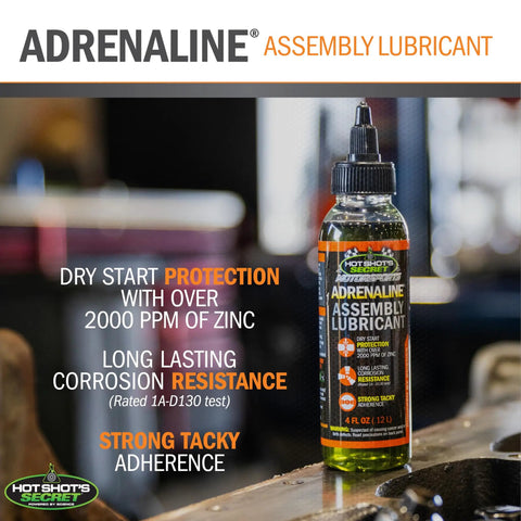 Adrenaline Assembly Lube 4 Oz For Gas And Diesel Engines Ultimate Break In Protection bottle on workbench