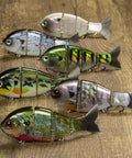 Mike Bucca Baby Bull Gill Swimbait, 3.75 Inch, Three Quarters Ounce Ruby Gill, shown in multiple finishes on wooden surface