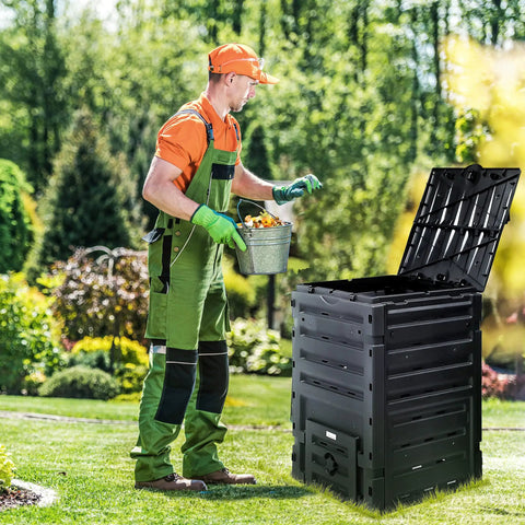 Man using Massive 120 Gallon Outdoor Compost Bin With Aeration System Snap On Top Lightweight Garden Tumbler in a yard.