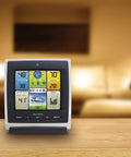 Notos 3 In 1 Weather Station For Indoor Outdoor Temperature Humidity And Wind Speed With Real Time Readings Plus Hyperlocal Forecast On An Illuminated Color Display showing various weather data on a wooden table.