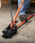 Workhorse Rebar Cutter And Bender For 5/8 Inch Steel in use, mounted on flat surface, cutting rebar with shear cut blades.