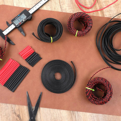Six Rolls Braided Cable Sleeves Kit With 127 Heat Shrink Tubes, PET expandable cord organizer, assorted colors on table