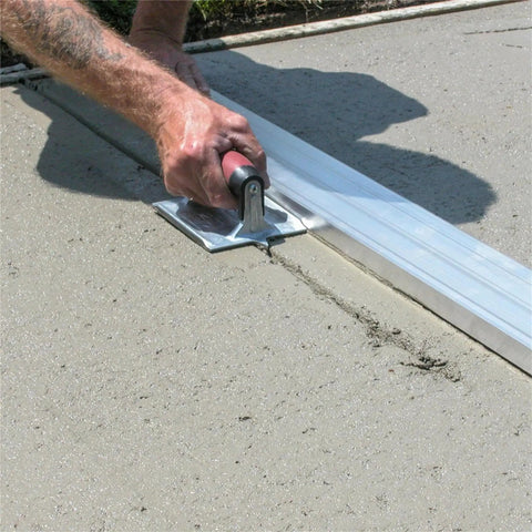 Using Heavy Duty Zinc Concrete Groover With DuraSoft Handle 6 By 4 And Three Eighths Inch Blade for precise concrete grooves on floor