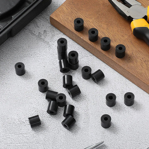 200 Pcs Black Nylon Spacers Half Inch Thick, Half Inch Outer Diameter, 0.194 Inch Inner Diameter displayed on a workbench