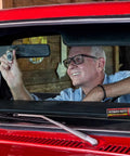 Man applying Two Ounce Epoxy Putty Stick That Delivers A Fast Hardcore Waterproof Bond For Cars Boats Plumbing And Home Repairs Cures Dark Gray Heat Resistant Up To 350 Fahrenheit Holds Four Tons Chemical And Fuel Resistant inside car