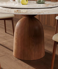 53 Inch Round Dining Table With Smooth Rotating Lazy Susan And Solid Hourglass Base Delivers A Clean Marble Look Top crafted detail of base.