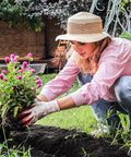 Woman gardening wearing Women Gardening Gloves Six Pairs Breathable Rubber Coated for Yard and Garden with Killer Grip, Medium Size.