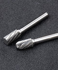 Close-up of 10 piece carbide burr set for metalwork with 1/4 inch shank, ideal for metal shaping and engraving.